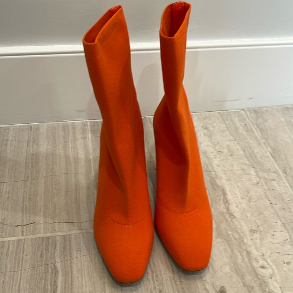 Orange Aldo sock boots.